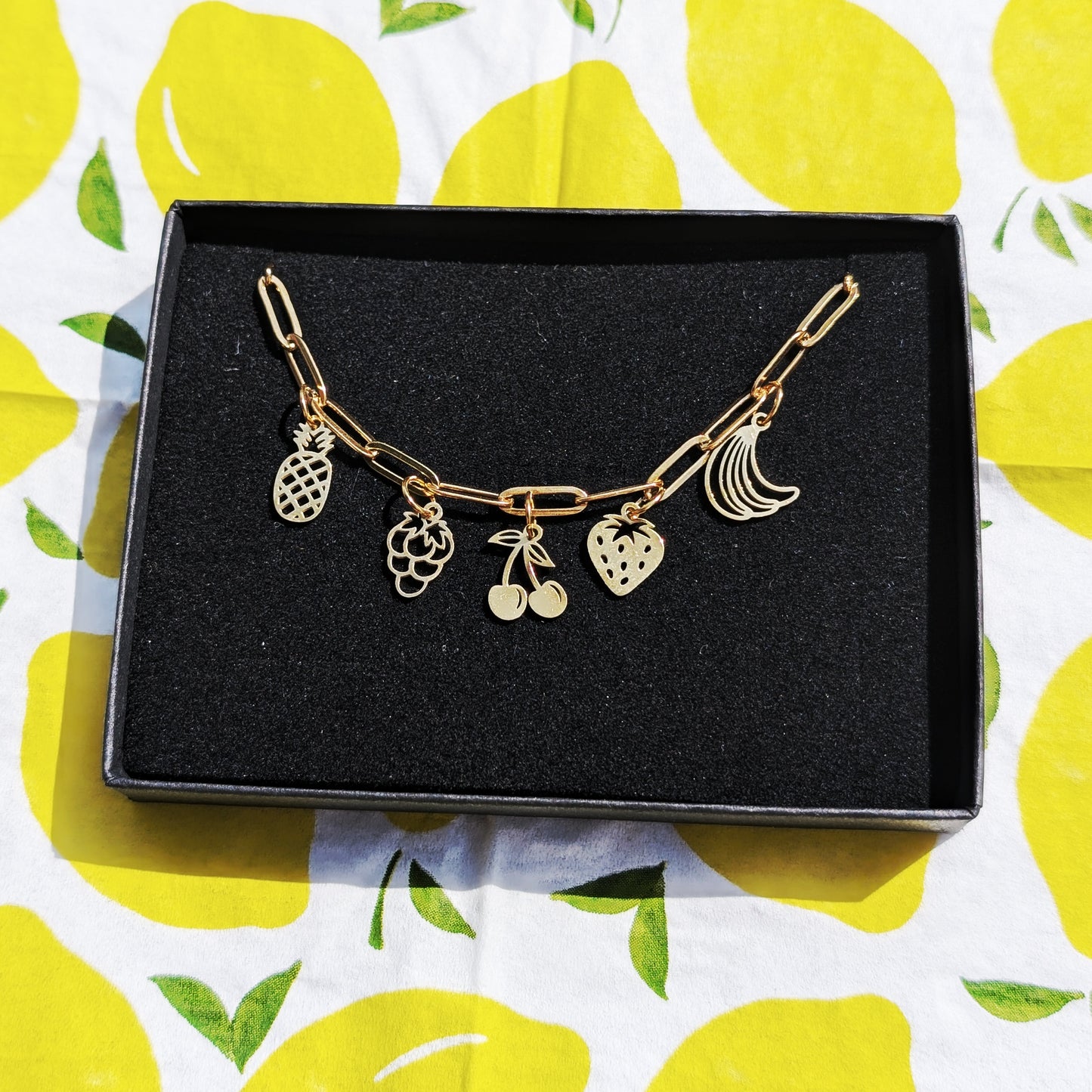Gold fruit charm necklace