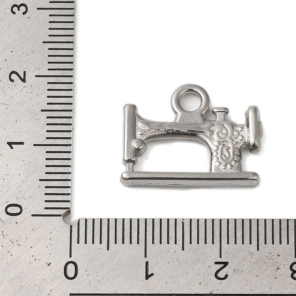 Silver sewing machine charm