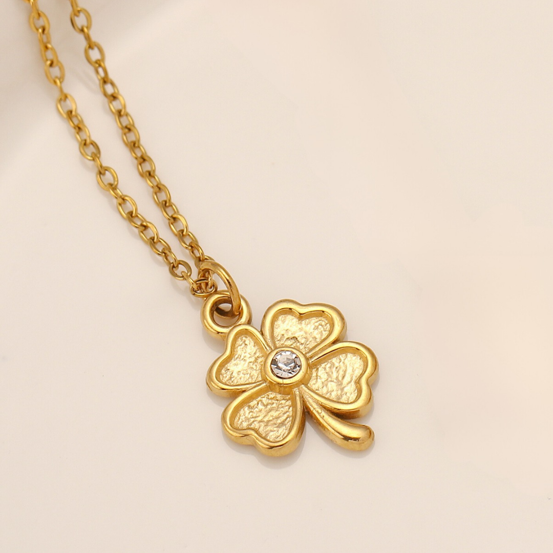Gold four leaf clover charm