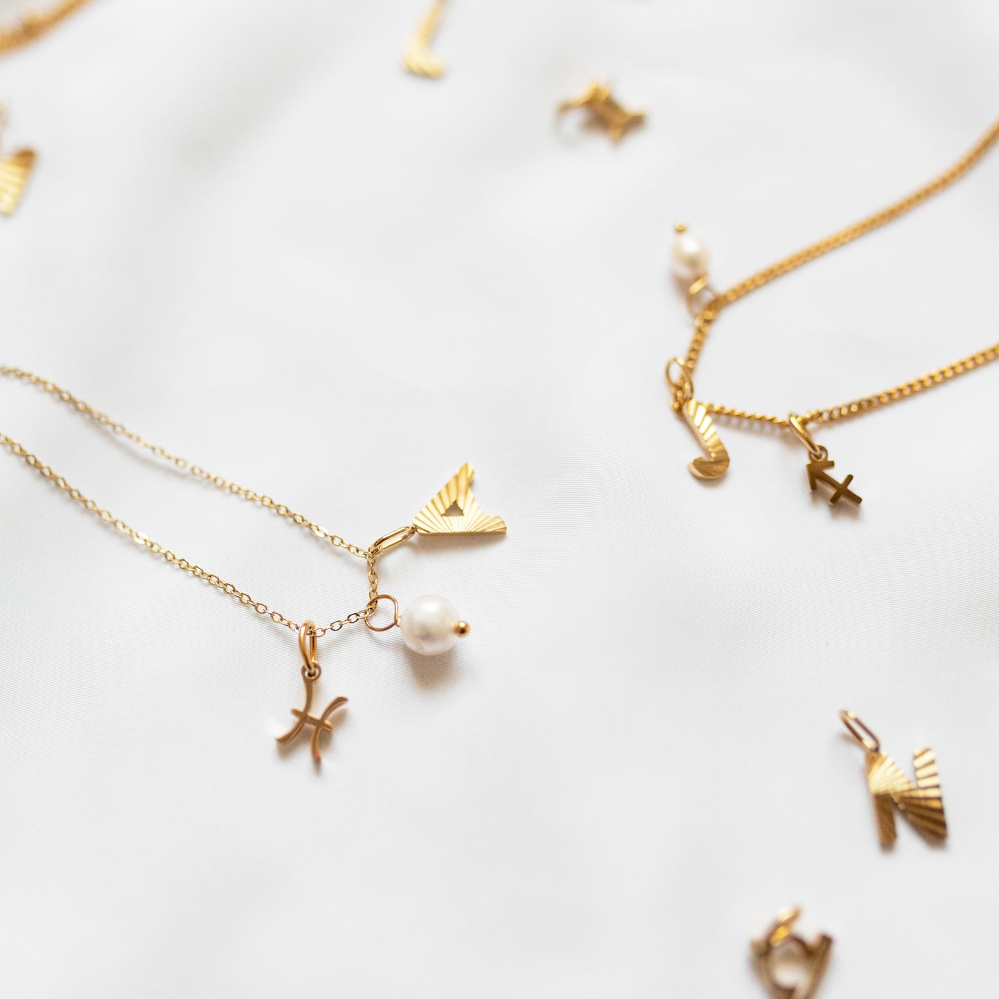 Gold pearl charm