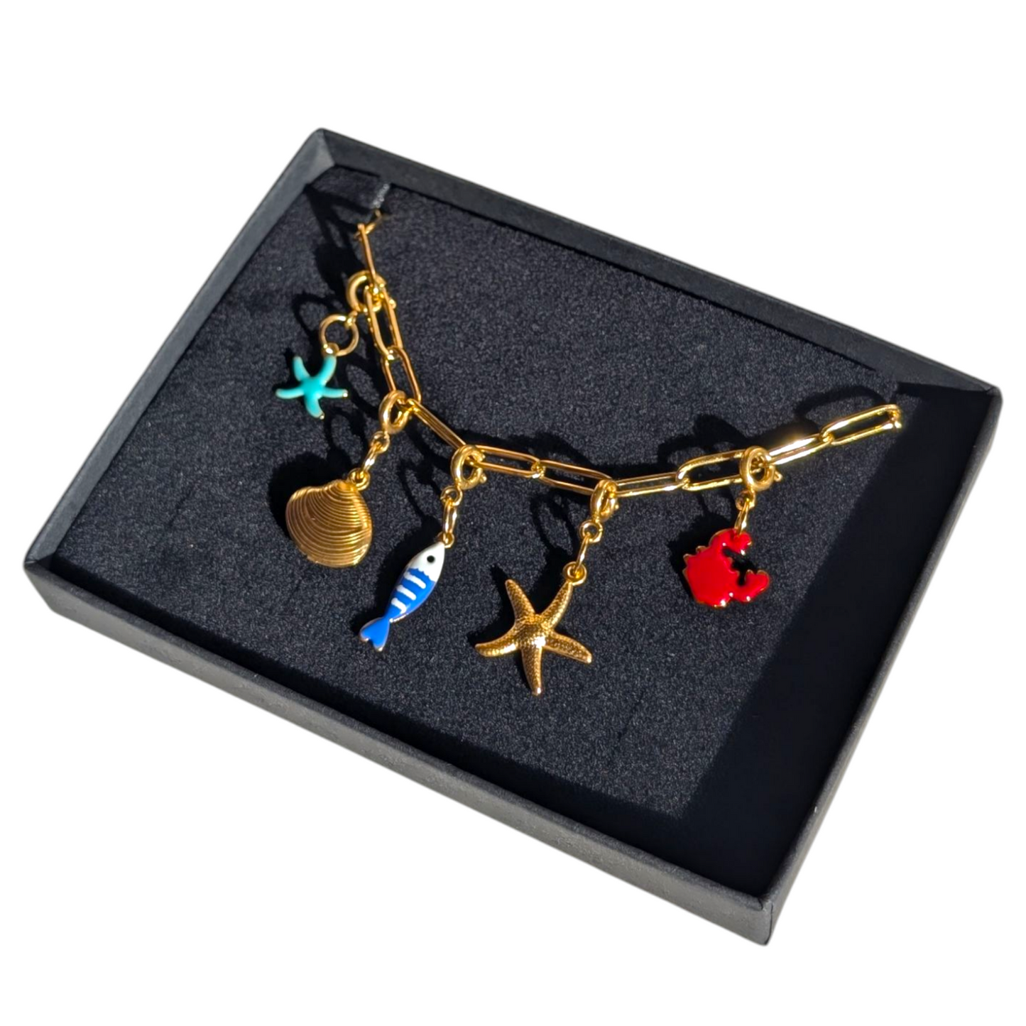 Gold sea charm necklace