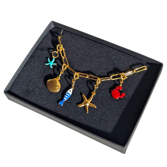 Gold sea charm necklace