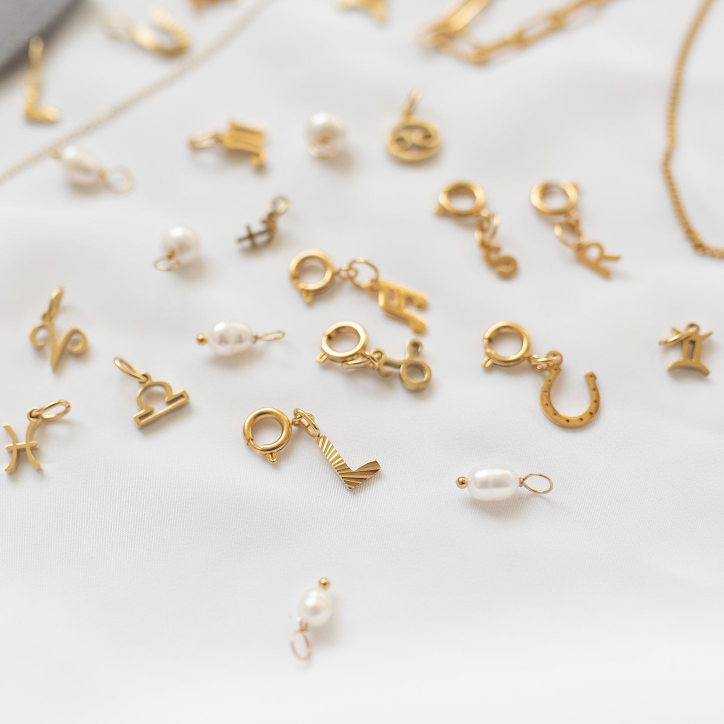 Gold pearl charm